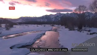 View of snowy American mountains and half frozen lake SCENIC