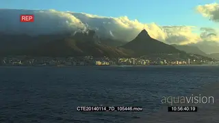 Zoom out from from boat travelling across to Cape Town City Lions head mountain Signal.