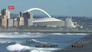 Scenic Durban beachfront people swimming surfing general behaviour Zoom in Moses Mabhida.