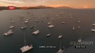 AERIAL of boats that sailed into Krakatea Island SUNSET
