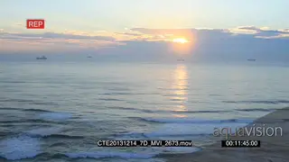 Scenic sunrise over ocean ships boats in the distant BG