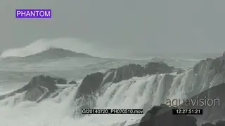 Big waves rolling in over rocks Overcast rain conditions PHANTOM