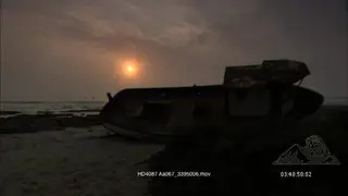 Scenic of a leaning Shipwreck with sunset.