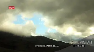 Close view of storm clouds moving over mountains SCENIC TL