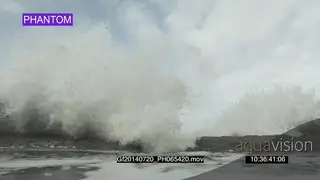 Big waves rolling in over rocks PHANTOM
