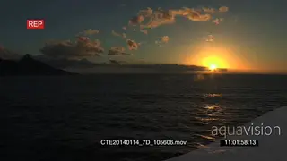 Scenic Sunset behind clouds over ocean Cape Town Lions head mountain left of frame