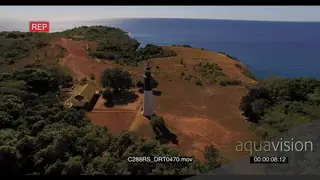 AERIAL of the Madagascar Island light house on the island GREEN