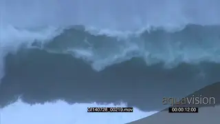 Big waves rolling in Overcast rain conditions