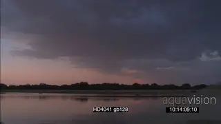 Cut away rain drops falling in Luangwa River as Rainclouds form TL SCENIC