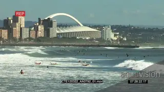 Scenic Durban beachfront Moses Mabhida stadium in BG people swimming surfing general.