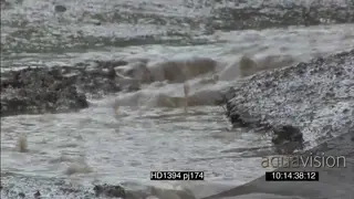 Cut aways of rain falling on ground small water streams