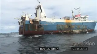 Commercial fishing trawler with longline in the water.